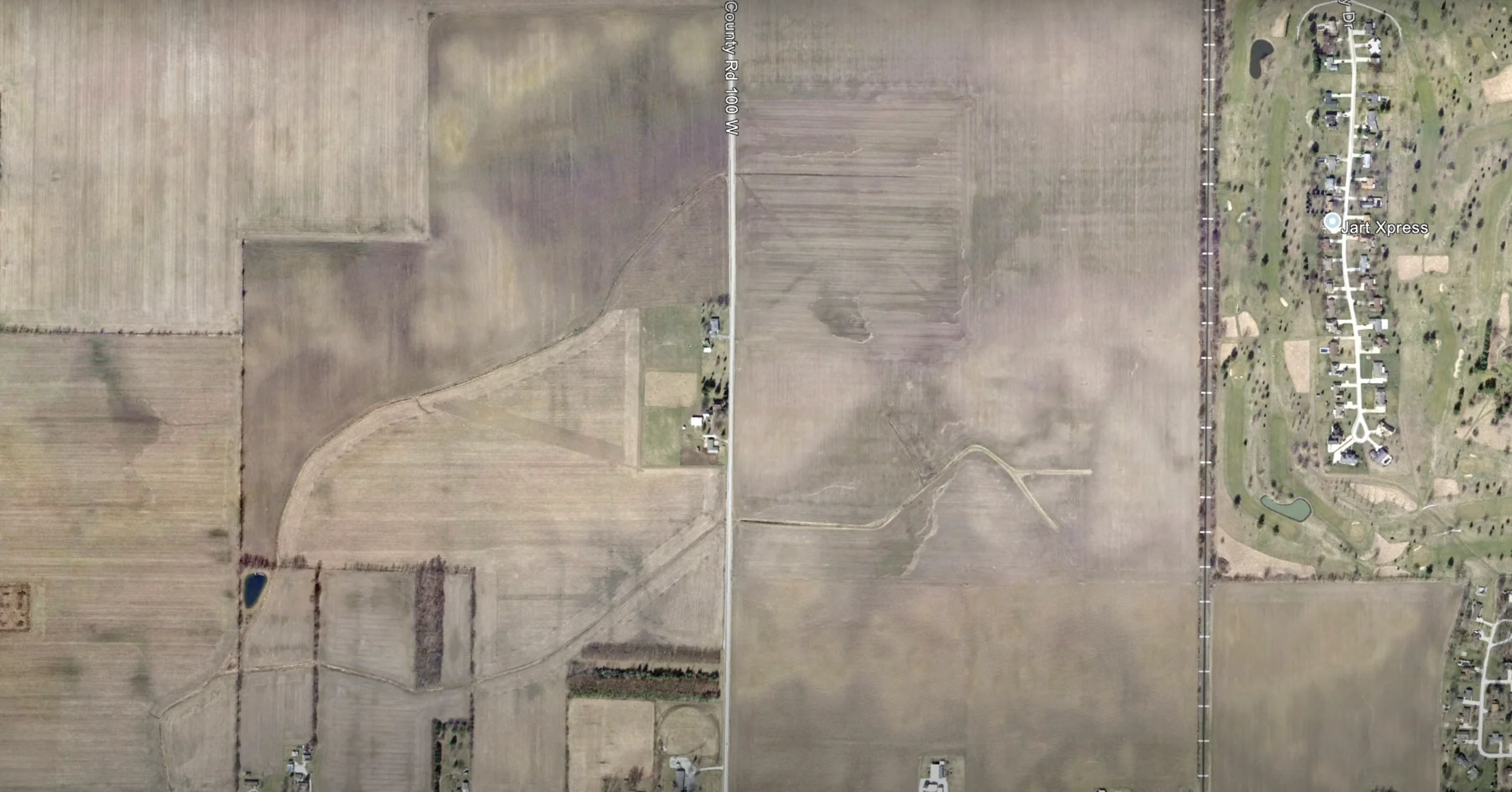 Aerial photograph comparison showing signs of drained wetlands including channelized streams and drainage ditches visible in historic imagery